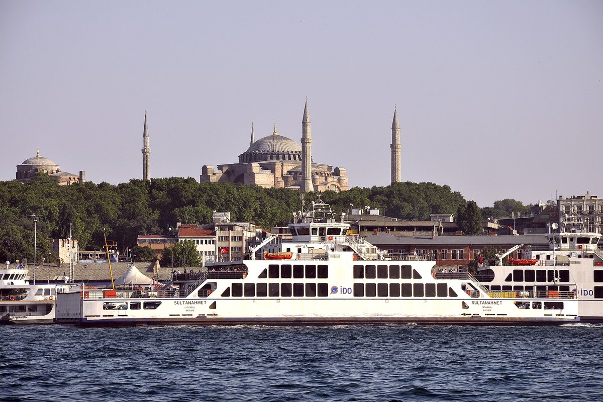 A ferry crosses the Bosphorus with Istanbul’s skyline behind it